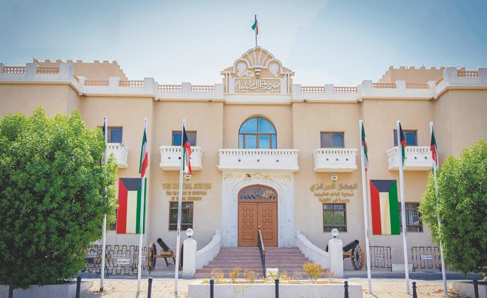 Officials assisting illegal residents in Kuwait with residency status regularization at the Sharq headquarters.