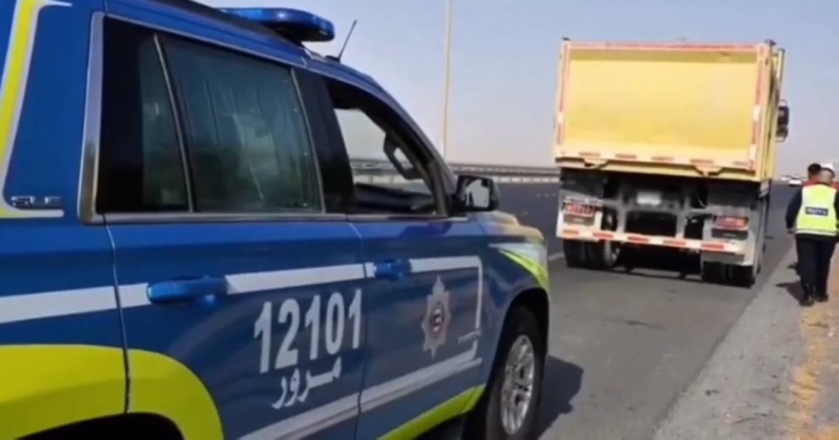 Kuwait traffic police monitoring vehicles during a highway campaign to catch violators.